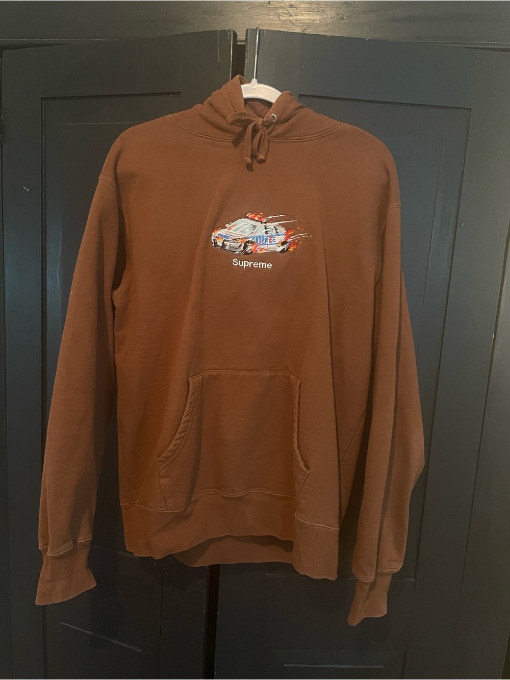 Supreme Brown Hoodie with Multicolor Racing Car Graphic